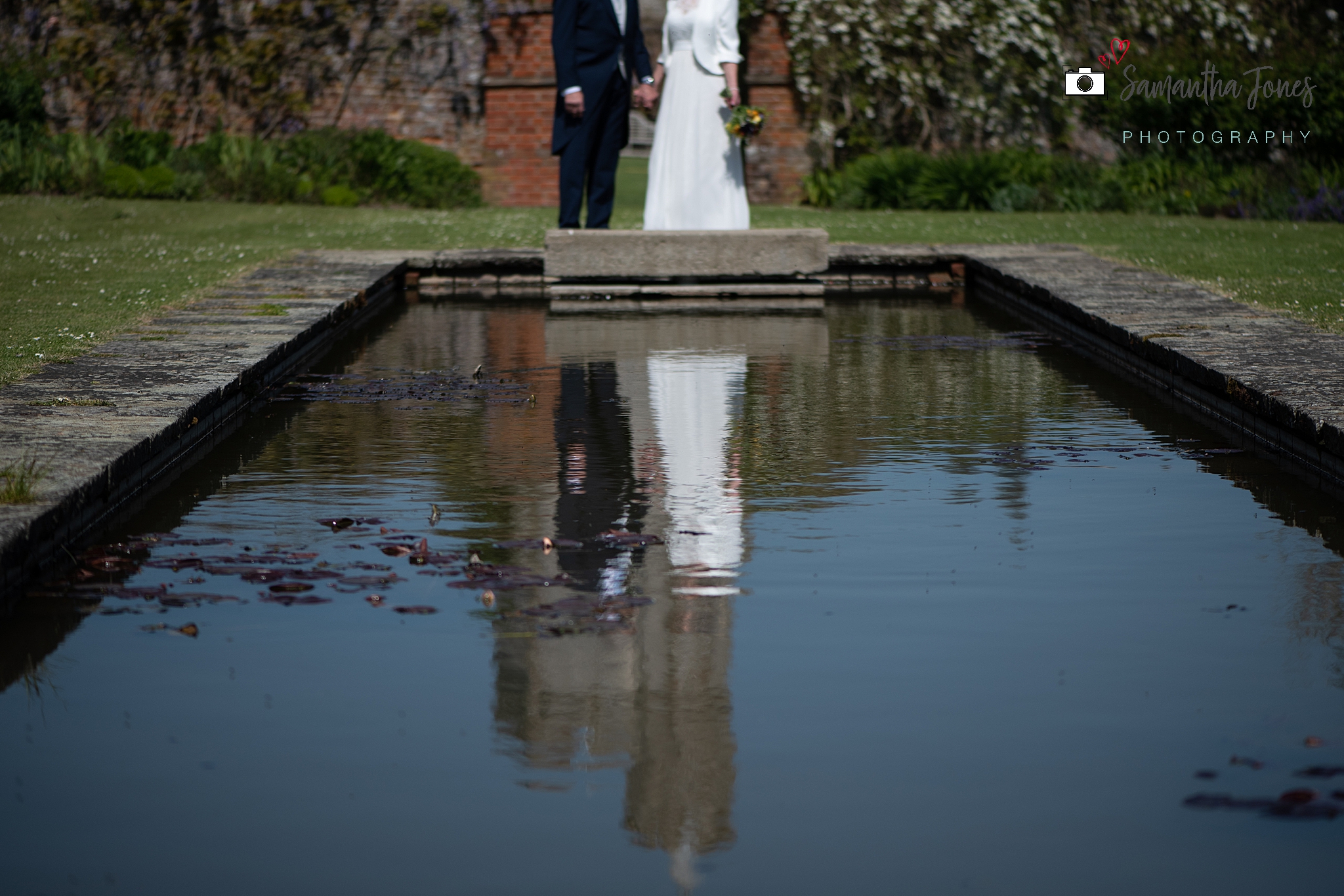 bride and groom reflected at Goodnestone Park