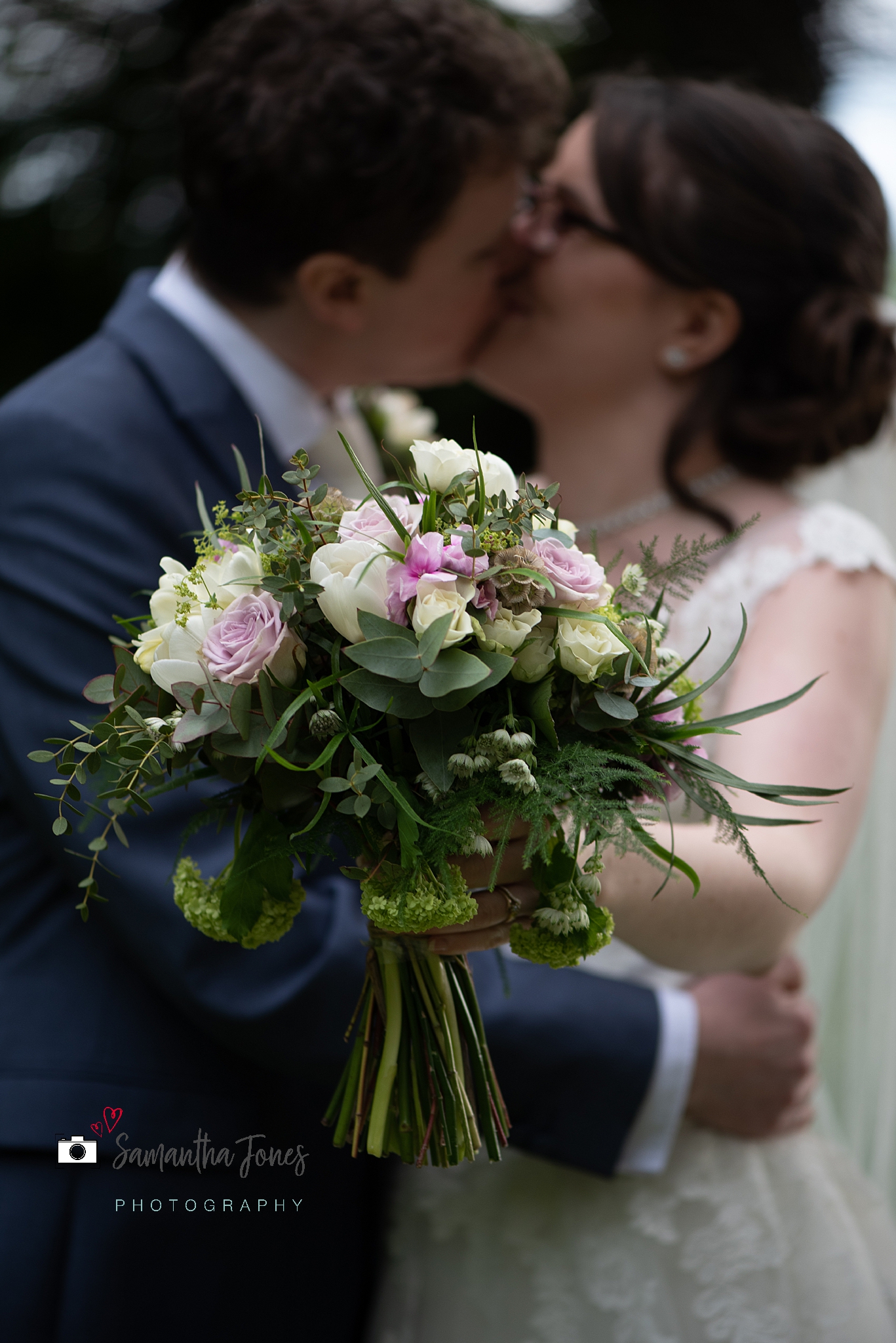 bride and groom portrait with bouquet