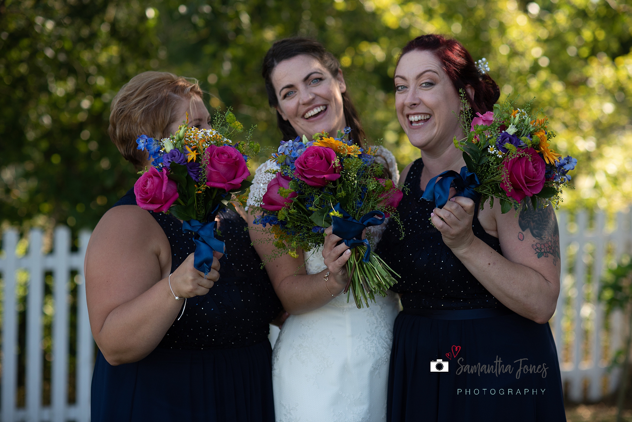 bride and bridesmaids floral bouquets Kent wedding at Stonelees by Samantha Jones Photography