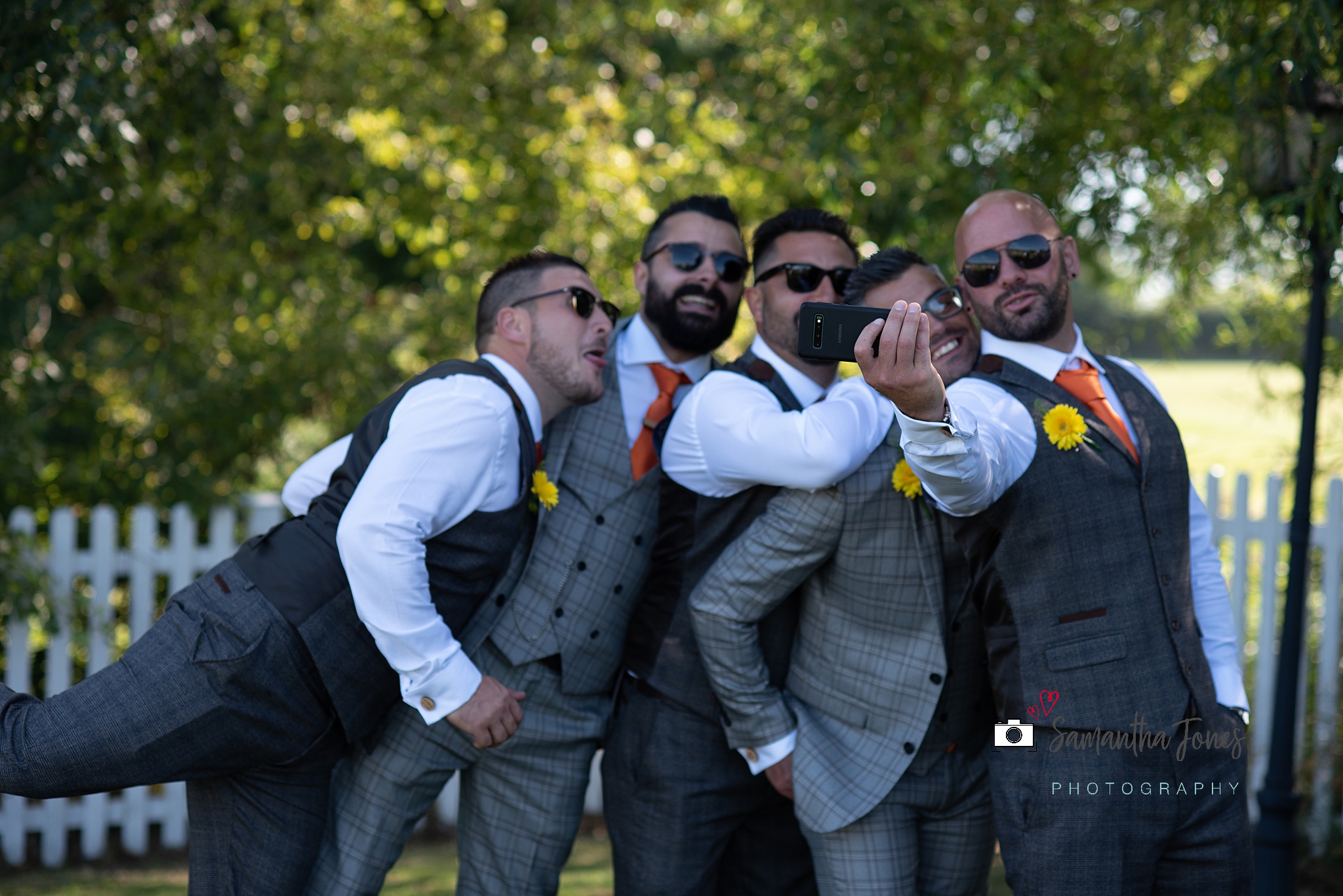 laughing groomsmen taking selfies Kent wedding at Stonelees by Samantha Jones Photography